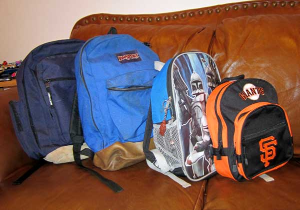 backpacks on sofa