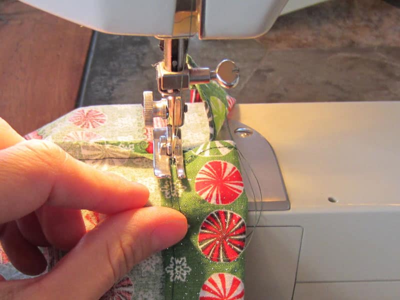 Never buy wrapping paper again! Sew this easy drawstring gift bag and save time, money, and the environment. Great use for fabric scraps or fat quarters.