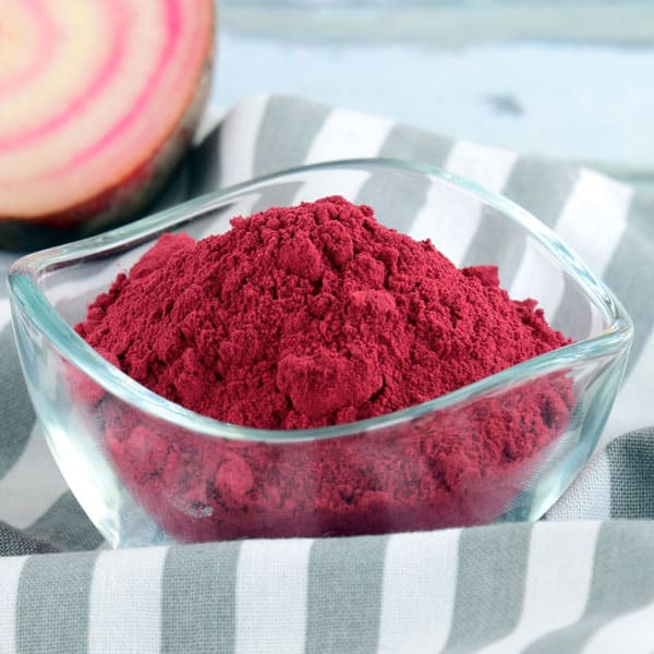 beet root powder in glass bowl on table