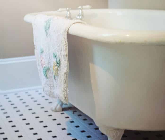 claw foot bathtub and towel