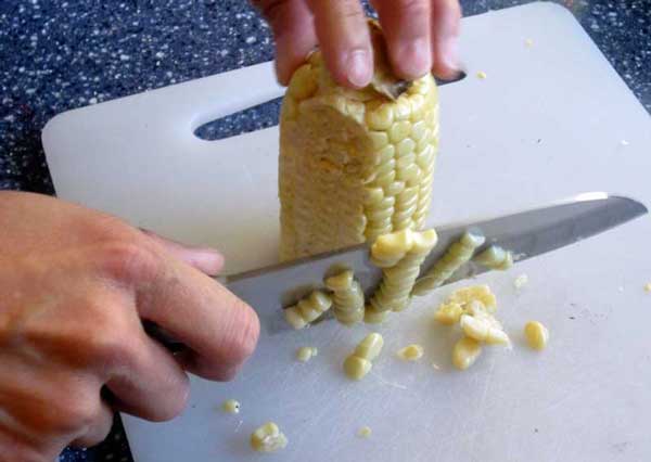 cutting corn off the cob