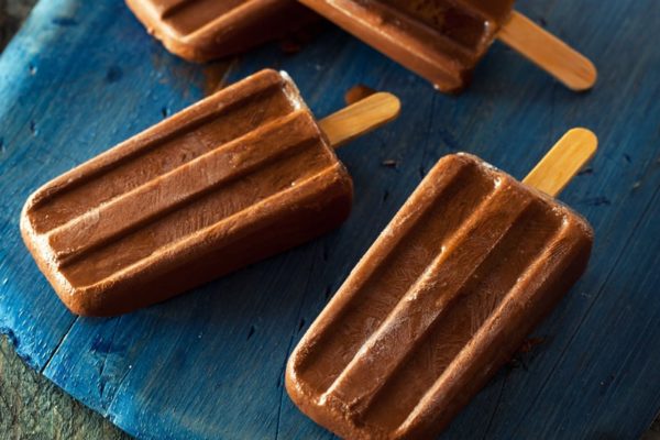 chocolate fudge pops on blue wood