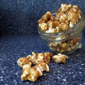 caramel corn spilling from jar