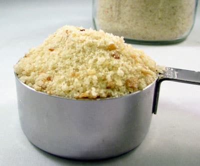 bread crumbs in a metal measuring cup