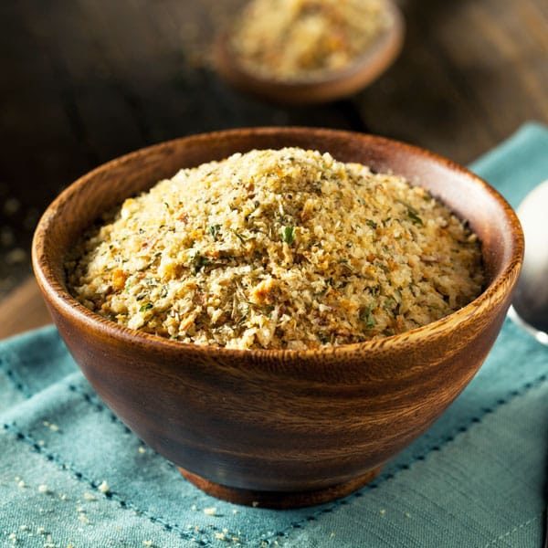 closeup bread crumbs on a blue cloth