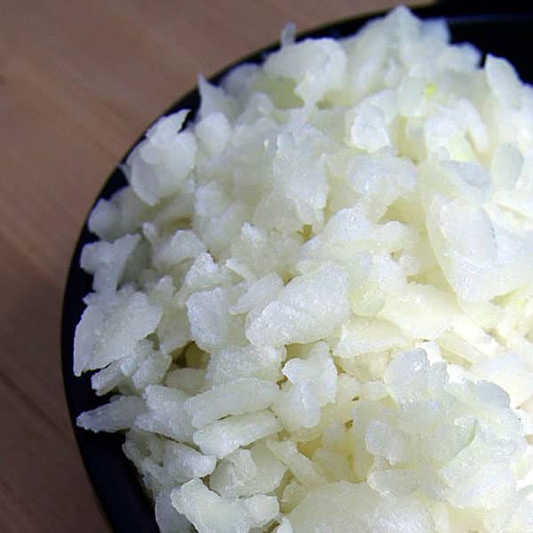 frozen chopped onions in black bowl