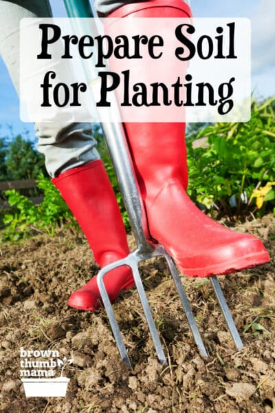 person wearing red boots digging in garden