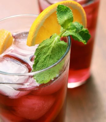 glasses of red juice with mint and lemon