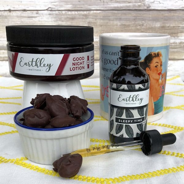 lotion, tincture, teacup and chocolate almonds