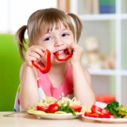 toddler eating red bell peppers