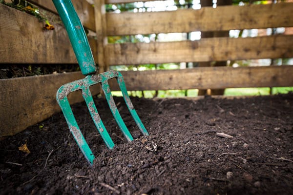 finished compost and pitchfork