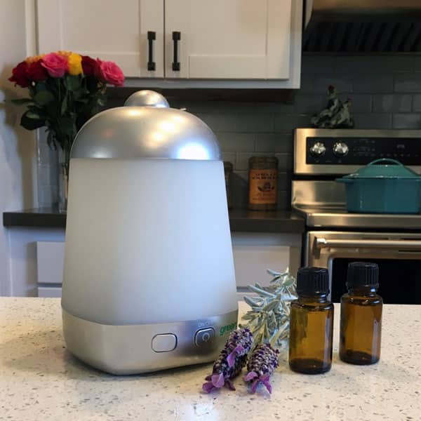 essential oil diffuser and lavender flowers in kitchen