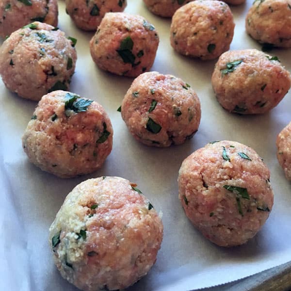 raw meatballs on tray
