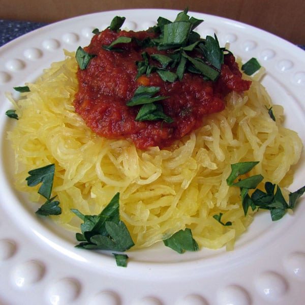 spaghetti sauce on top of cooked spaghetti squash