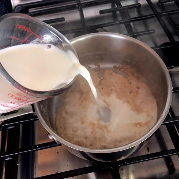 adding water to roux in saucepan