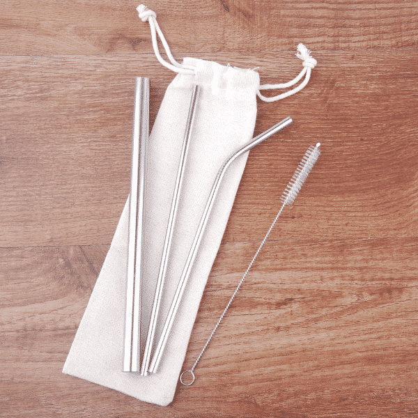 stainless steel straws and pouch on wood table