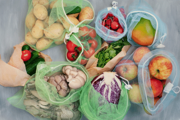 reusable produce bags and vegetables