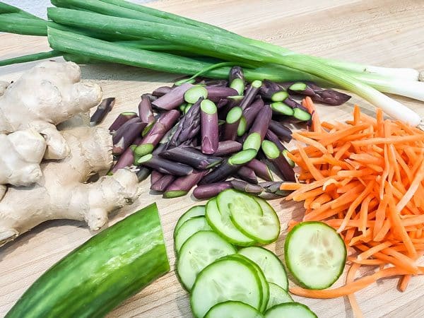 ginger, green onions, purple asparagus, carrots, cucumber