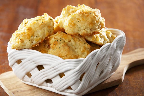 cheddar bay biscuits in white woven bowl