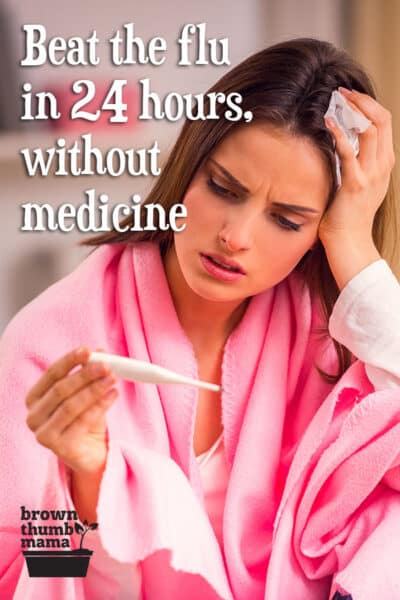 woman in pink robe holding thermometer