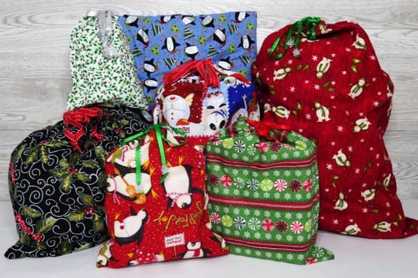 colorful fabric gift bags full of presents