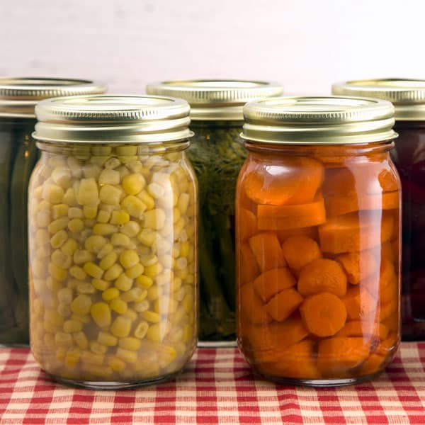 home canned vegetables on gingham cloth