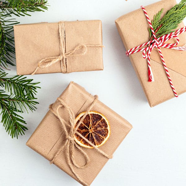 gifts wrapped in brown paper and string