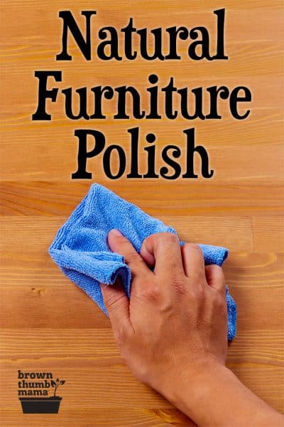 hand holding blue cloth polishing table