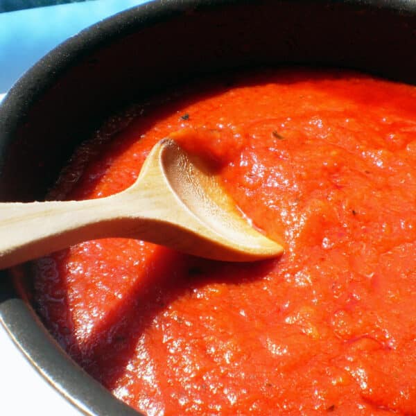 simmering tomato sauce in pan