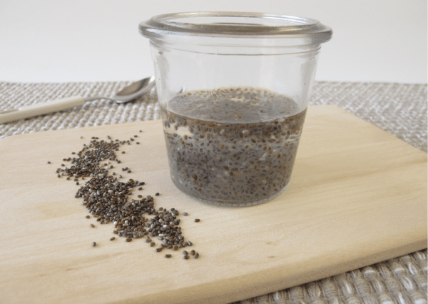 chia seeds and chia gel on a wooden cutting board